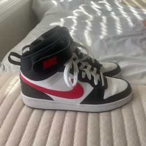 Nike high top dunks with two different color check marks